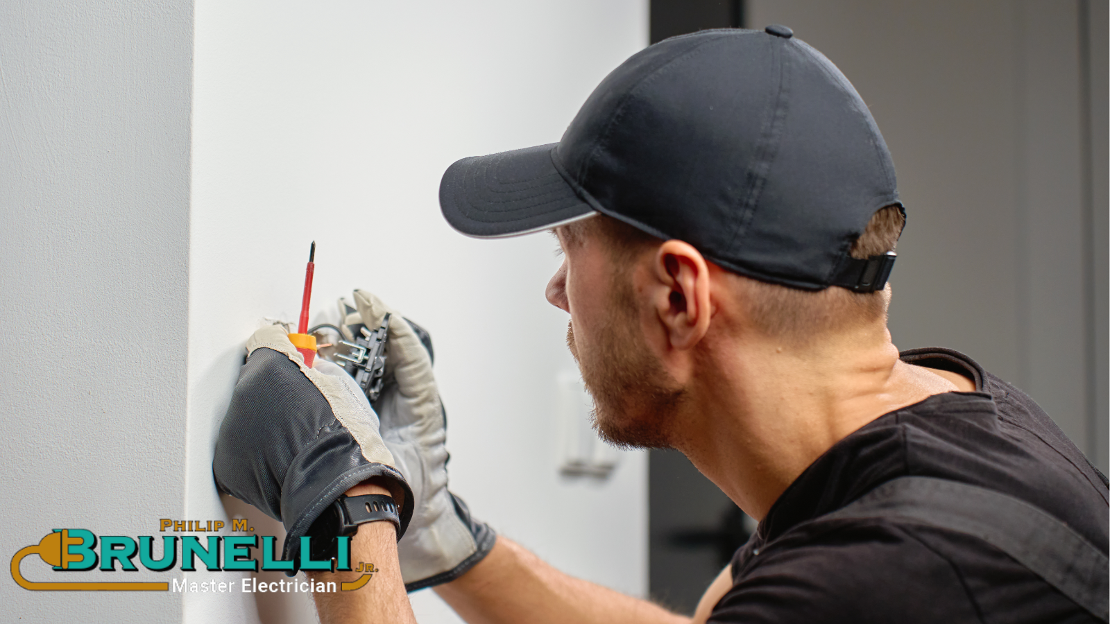 Electrical installation with electrician in black hat